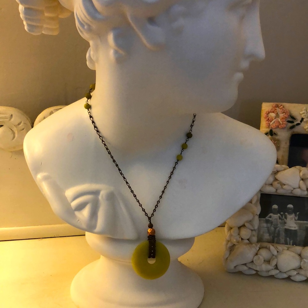 Handmade jade and copper necklace.